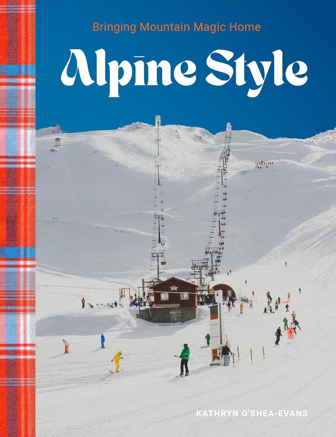 Front Cover of Alpine Style book. Apres Ski resort with active skiers pictured. 