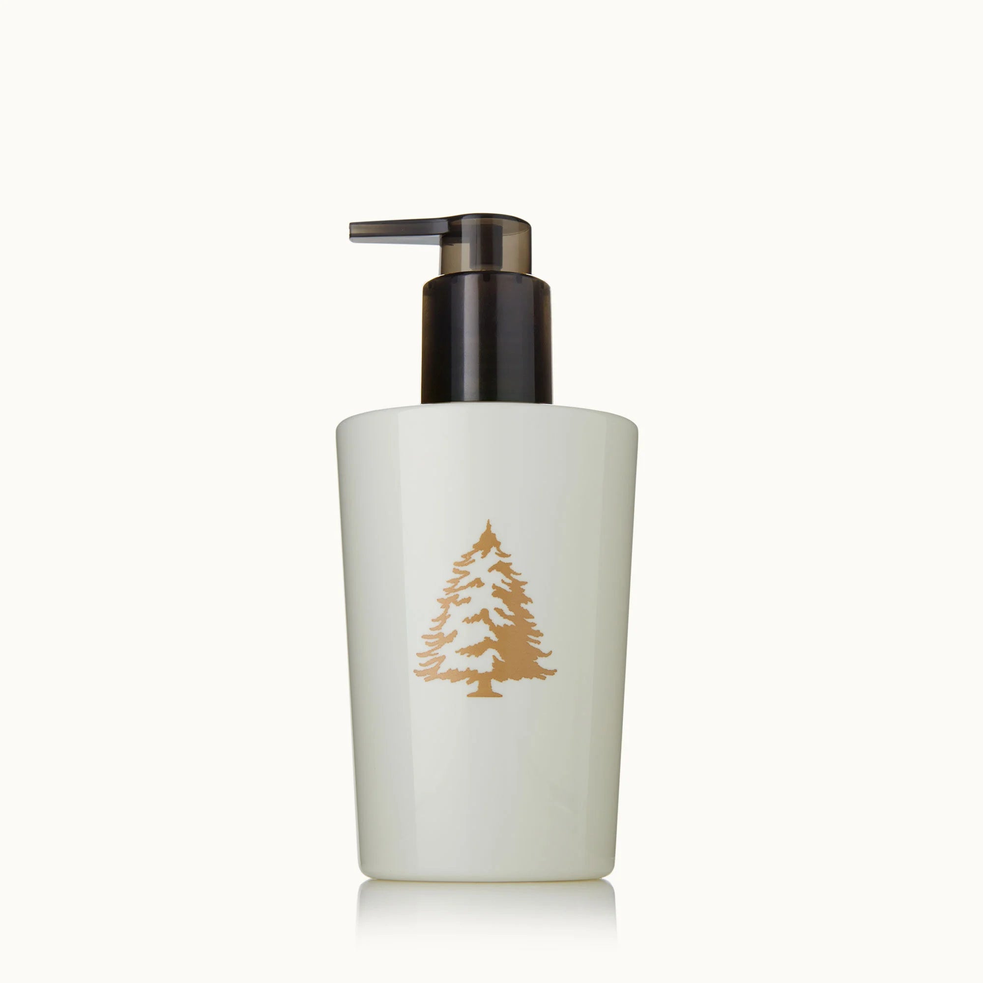 Frasier Fir hand lotion in plastic holiday bottle. Gold tree design. 