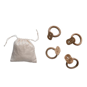 set of four natural handmade bamboo napkin rings displayed with linen storage sack. 