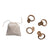 set of four natural handmade bamboo napkin rings displayed with linen storage sack. 