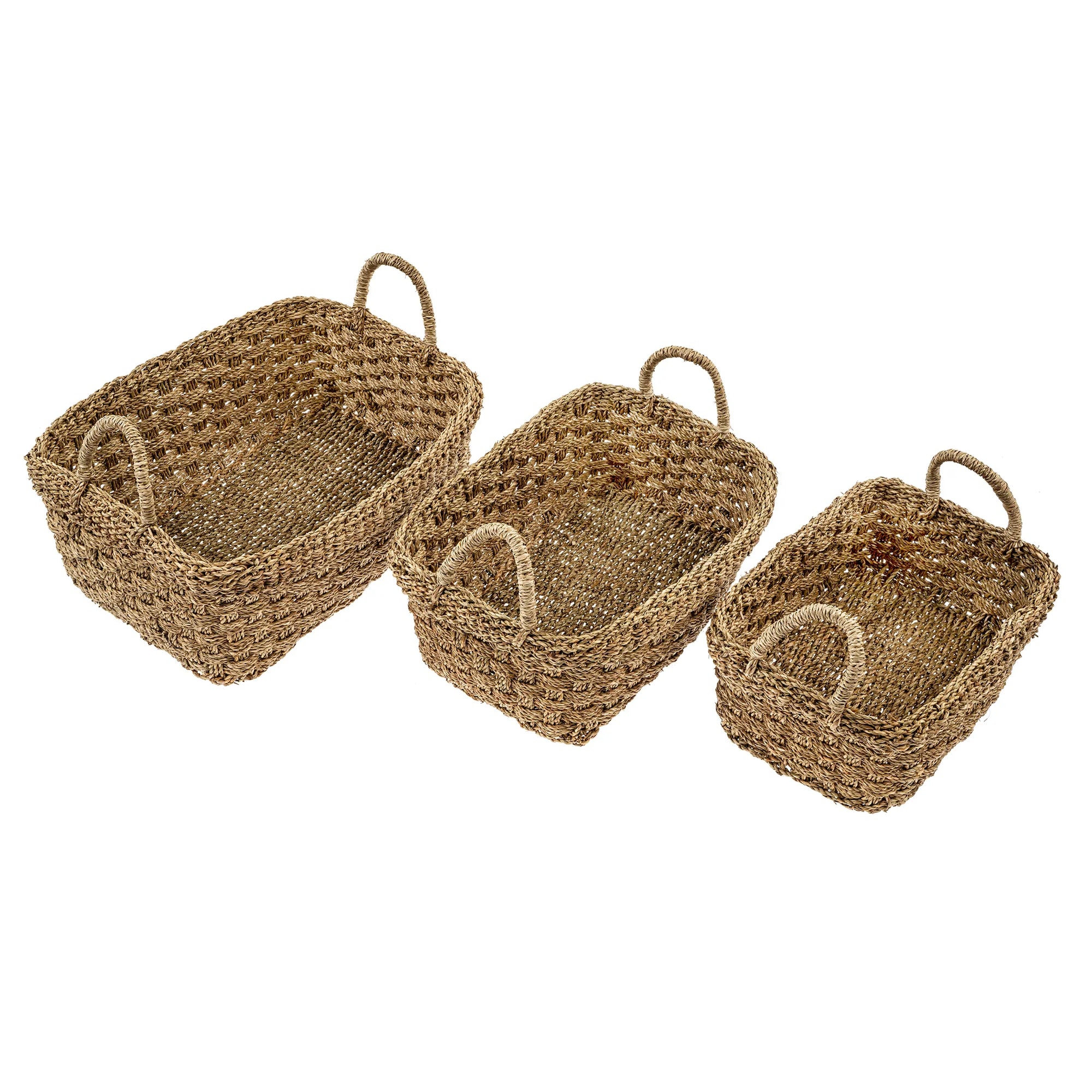 Three different sized baskets made of seagrass with a checkered pattern and handles side by side.