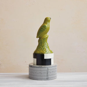 black and white dotted round decorative box displayed under bird figurine. Home decor. Trinket box. 