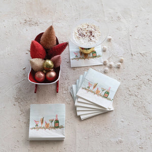 holiday cocktail napkins displayed under cocktail drinks. Holiday bar accessories. 