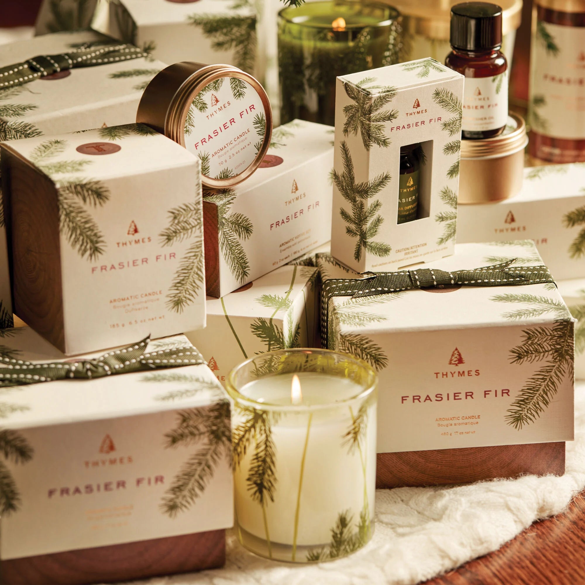 Frasier Fir holiday collection. Classic green and gold pine needle design. Thymes. 