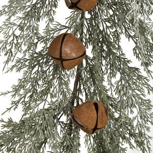 Enlarged detail of rust bells on faux cedar garland. 