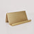 Brass card holder with a tented back and lip to hold cards upright.