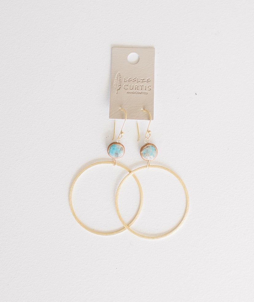 Two inch gold hoop earrings with small turquoise beads. Boho chic style