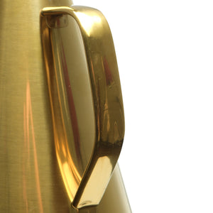 Handle detail of Stainless steel oil or vinegar cruet in gold finish. Kitchen decor. 
