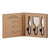 Three stainless steel cheese knives in a cardboard gift box.