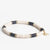 Black and cream sequin stretch bracelet with gold accent hardware. Hand made in India. Ink & Alloy.