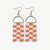 Orange checkered beaded fringe earrings with gold brass arch