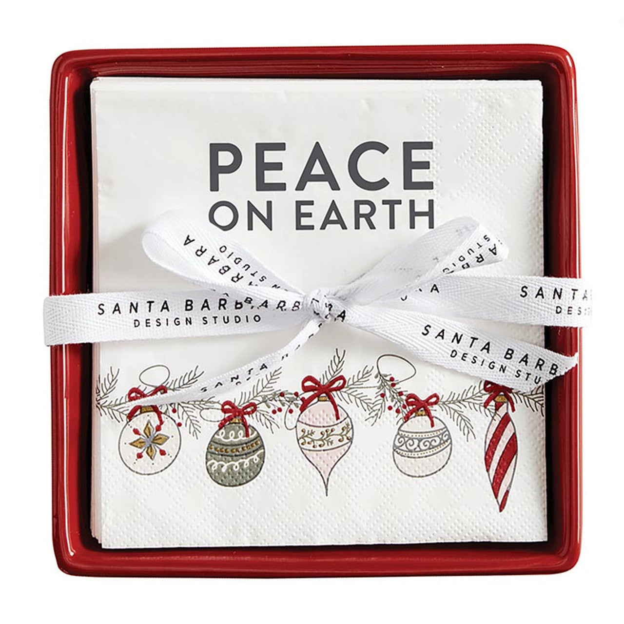 Red ceramic napkin tray with Peace on Earth holiday napkins included. 