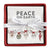 Red ceramic napkin tray with Peace on Earth holiday napkins included. 