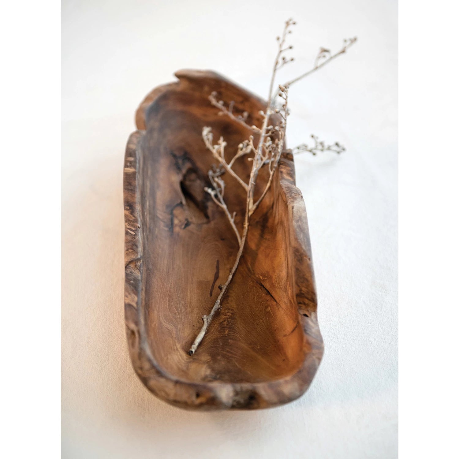 Hand made teak wood decorative tray with floral stem displayed. 