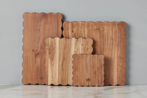 Scalloped edge collection of varying sized acacia wood cutting boards. Old world charm. Kitchen decor. 