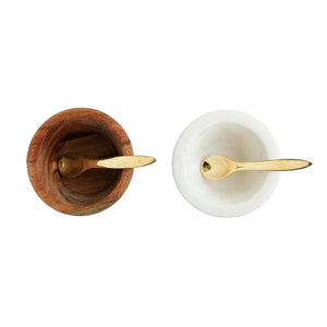 Inside view of white marble and mango wood pinch pots with brass spoon set. 