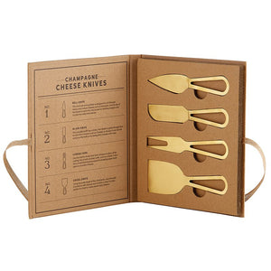 Bright gold cheese knife set in a cardboard box with explanations about each knife.